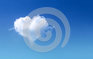 White fluffy heart shaped cloud patterns soft focus on clear blue sky  and copy space , Valentines day background