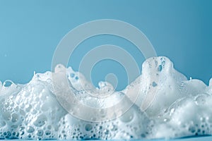 Close-up of white foam against a blue background