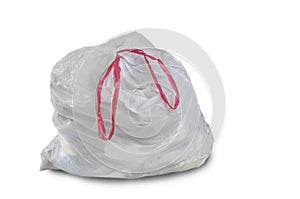 A close up of a white garbage trash bag