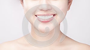 Close up of  white healthy teeth of beautiful smile young woman