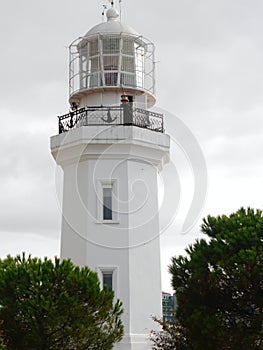 Close up of white lighthouse in coastal city of Batumi, Georgia