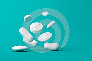 Close up of white pills or aspirin tablets on green background with pharmacy and medical concept. White capsule or drugs. 3D