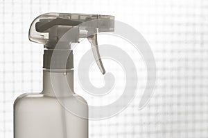 Close up white plastic foggy spray bottle head.