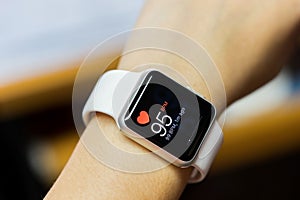 Close up white smart watch with health app