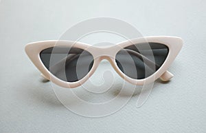 Close up  white sunglasses isolate on a gray background