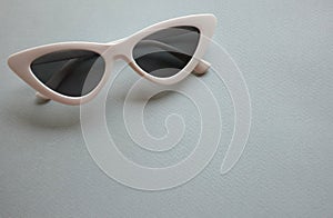 Close up  white sunglasses isolate on a gray background