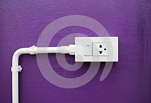 Close-up White Switch And Plug on Purple wall