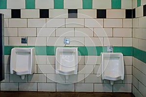 Close up white urinals men public toilet in ceramic urinals in toilet room