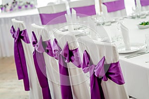 Close-up of white wedding chairs