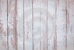 Close up of white wooden fence panels.