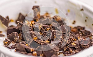 Close-up of white yogurt and pieces of brown chocolate, health f