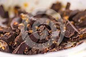 Close-up of white yogurt and pieces of brown chocolate, health f