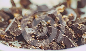 Close-up of white yogurt and pieces of brown chocolate, health f