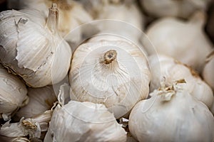 A Close Up of Whole Garlic For Sale on a Market Stall
