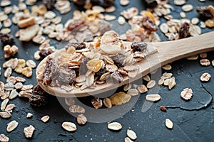 Close-up of wholegrain muesli on wooden spoon