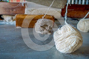Close up of a whool to work on loom manufacturing whool shawl clothing in Nepal
