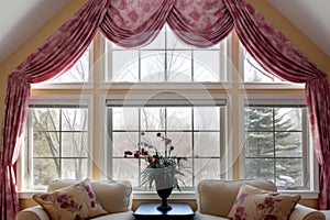 close-up of wide dormer windows with different drapery styles