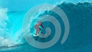 CLOSE UP: Wild emerald water splashes over surfer\'s head riding a barrel wave