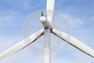 Close up wind turbine alternative energy with blue sky background