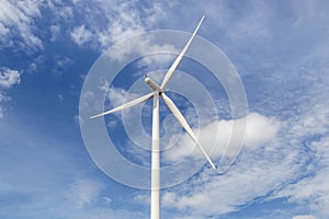 Close up wind turbine with blue sky