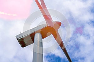 Close up of Wind turbine generating electricity clean energy with cloud background on the sky. Clean energy concept.