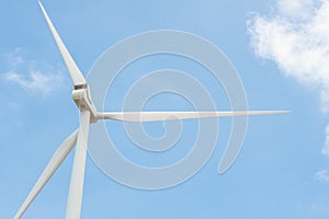 Close-up wind turbine in rotation to generate electricity energy on outdoor with  blue sky background, Conservation and