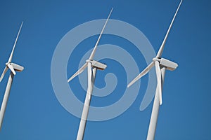 Close Up Wind Turbines Against Blue Sky Tehachapi California photo