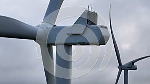 Close-up of Windfarm Turbines rotating in the wind