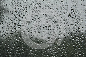 close-up: window with big raindrops durring the heavy rain