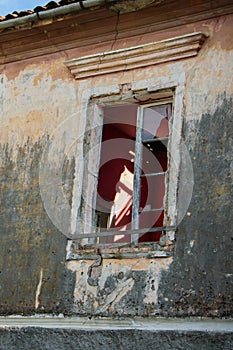 Close up of window of old abbandoned house