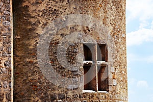 Close-up of a window in old medieval stronghold castle tower