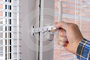 Close-up of window sash fittings. The lock of the opening.