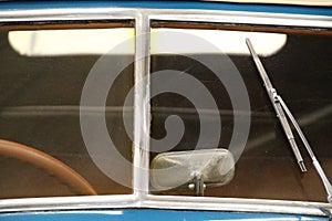 Close-up on the windscreen and part of the steering wheel of an old classic car photo