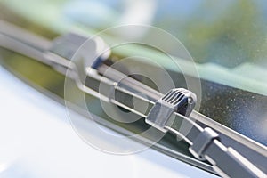 Close up of a windscreen washers on wiper driver. Modern car technology