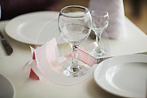 Close up of wine glass and name card. Table setting