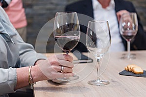 Close up on wine glasses in vineyard shop at tasting experience