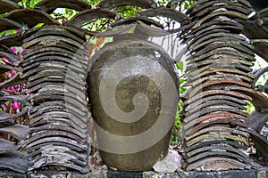 Close-up of wine jars placed outdoors in rural China