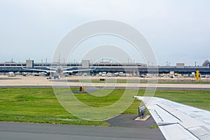 Close up of Wing of Airplane on Airplane waiting for Maintenance  Background