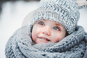 Close up winter portrait of adorable smiling baby girl