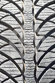 Close-up winter tire tread. Textured tire tread.