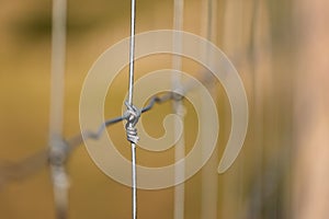 Close-up of wire fence creating enclosure