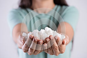 Close up woman beautiful hands holding white sugar cubes. Healthcare concept