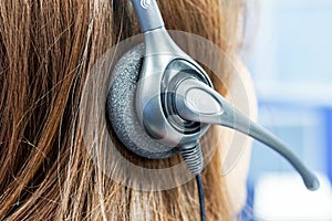 Close up woman callcenter on the job with headset photo