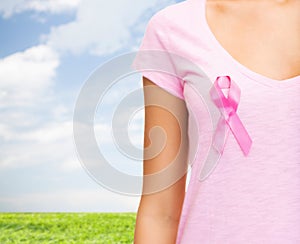 Close up of woman with cancer awareness ribbon