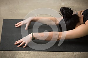 Close up of woman in Child pose on the mat