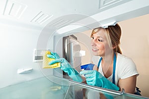 Close-up Of Woman Cleaning Refrigerator