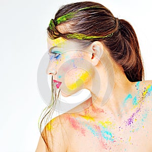 Close up of woman with colored paint on face