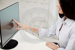 Close up of woman with computer monitor in office