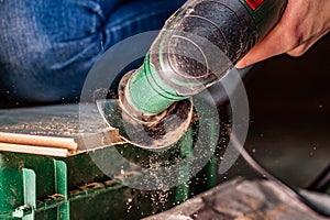 Close up of woman cutting laminate of wooden floor