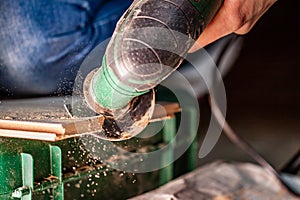 Close up of woman cutting laminate of wooden floor